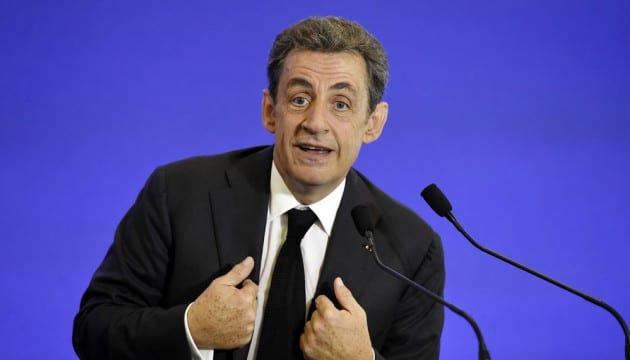 Nicolas Sarkozy, former French President and leader of France's main opposition right-wing "Les Republicains" party, (formerly known as UMP), gestures as he gives a speech during a welcoming meeting for new members of the party, on June 13, 2015, in Paris. AFP PHOTO / ALAIN JOCARD