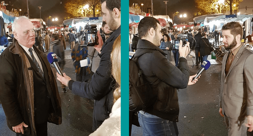 Campagne électorale pour la législative partielle de l'Essonne : Yavar Siyahkalroudi et François Asselineau interrogés par BFM-TV sur le marché de Courcouronnes.